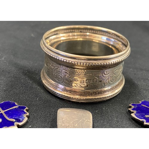 579 - 3 silver and enamel spoons and a silver napkin ring