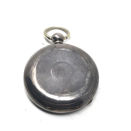 371 - silver open face pocket watch  the watch is ticking