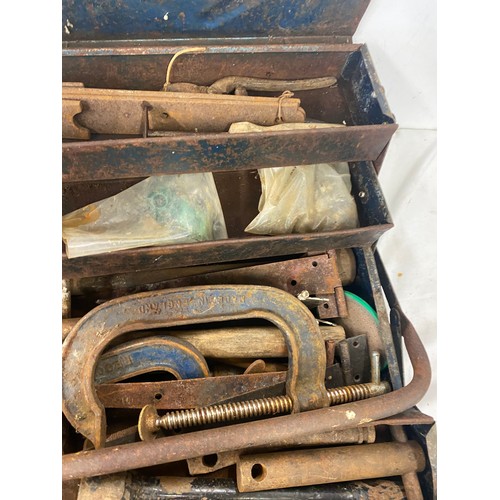 249 - Blue metal tool box with contents includes g clamps, door fittings and wire brush spanners etc