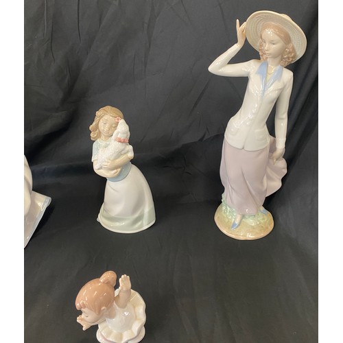 75 - Selection of Nao pottery figures includes spring reflections figure etc