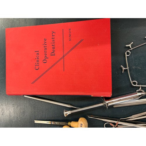 295 - Selection of dentist equipment includes clamps, book etc