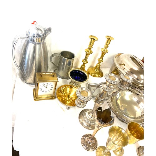 246 - Large selection of assorted metal ware includes Candle sticks, brass, silver plate etc