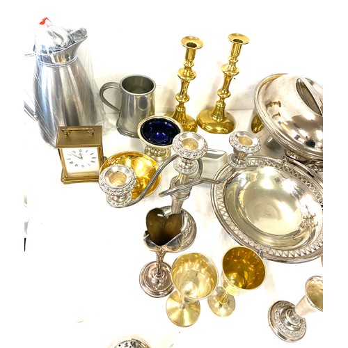 246 - Large selection of assorted metal ware includes Candle sticks, brass, silver plate etc