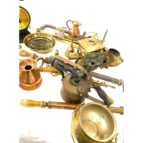 182 - Large selection of brass and copper ware includes jugs, candle sticks, kettles, bells etc