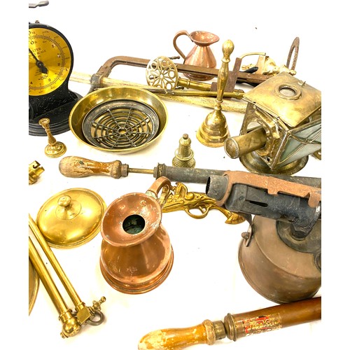 182 - Large selection of brass and copper ware includes jugs, candle sticks, kettles, bells etc