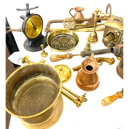 182 - Large selection of brass and copper ware includes jugs, candle sticks, kettles, bells etc