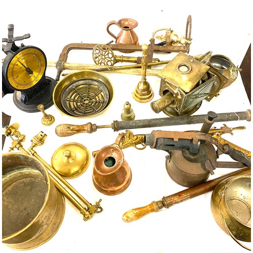 182 - Large selection of brass and copper ware includes jugs, candle sticks, kettles, bells etc