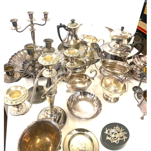 242 - Large selection of silver plated items includes Jugs, Tea pot, candle sticks etc