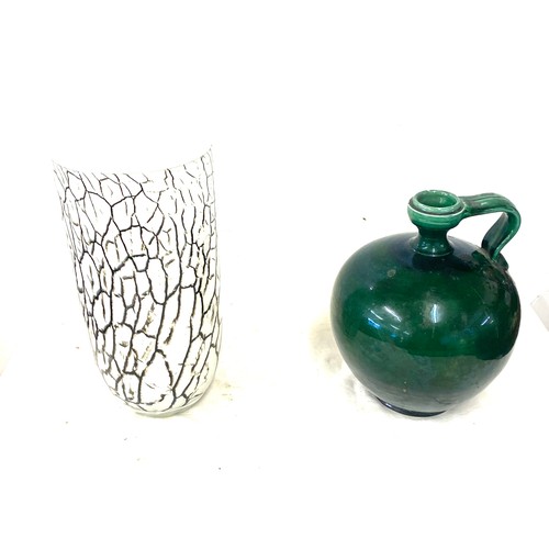 55 - Green pottery flagon and a glass vase