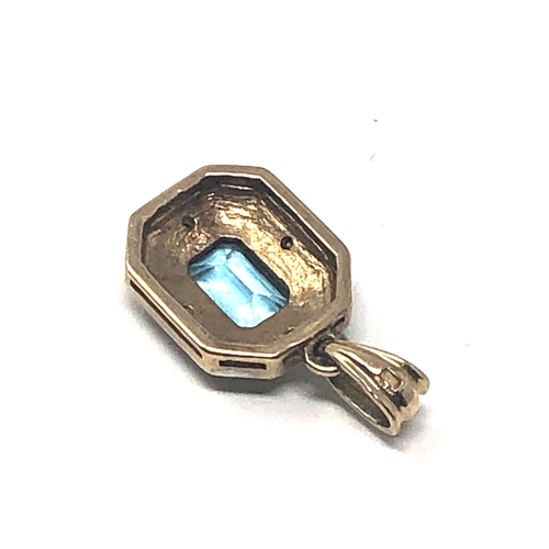 68 - 9ct gold topaz & diamond pendant weight 1.8g