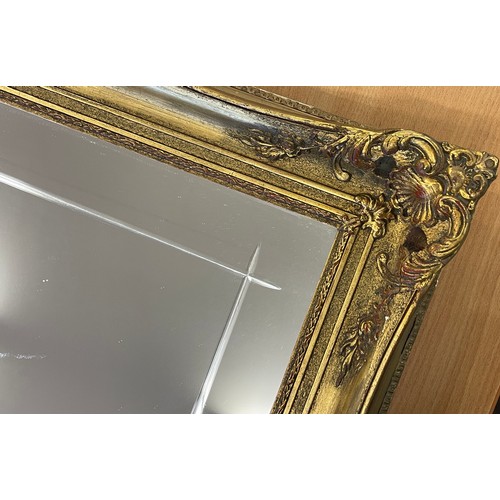 324 - Large gilt framed mirror, approximate measurements: 29 x 25 inches