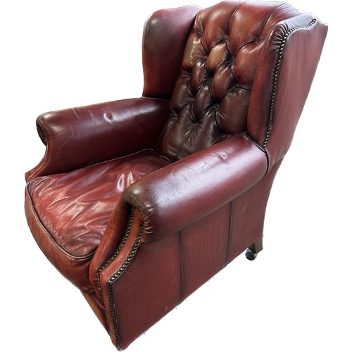 398 - Ox blood leather Chestefield armchair, approximate measurements:Height 39 inches, width 34 inches, d... 
