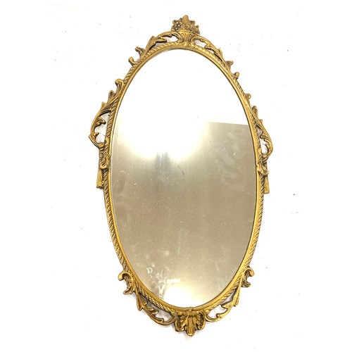 69 - Vintage gilt framed mirror measures 14 inches tall 7 inches wide