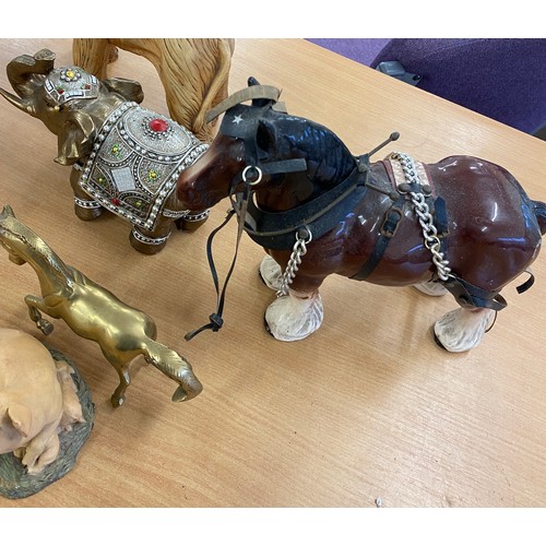 133 - Large selection of animal figures includes Cast iron door stop etc