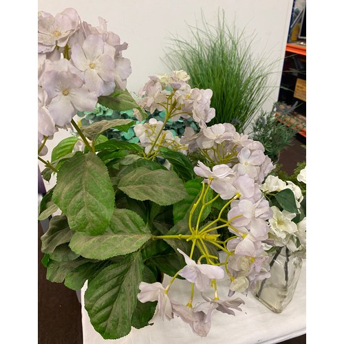 240 - Large selection of artificial plants in pots