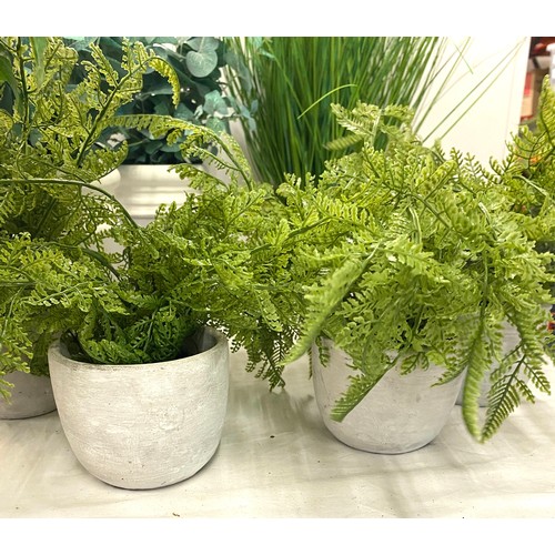 240 - Large selection of artificial plants in pots