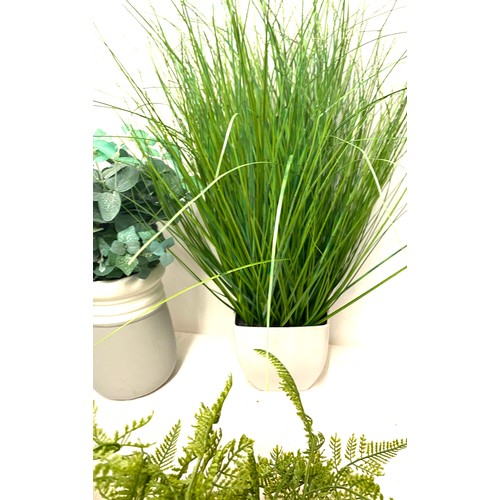 240 - Large selection of artificial plants in pots