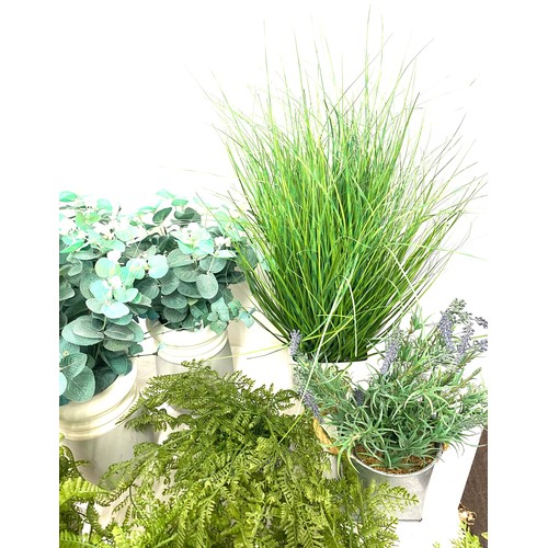 240 - Large selection of artificial plants in pots