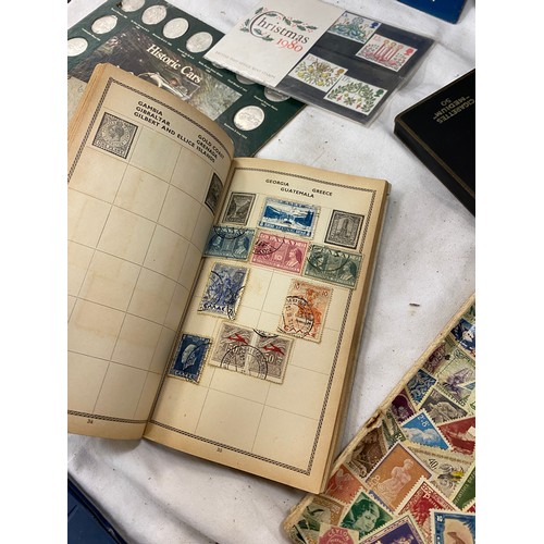 121 - Large selection of assorted stamps and coins