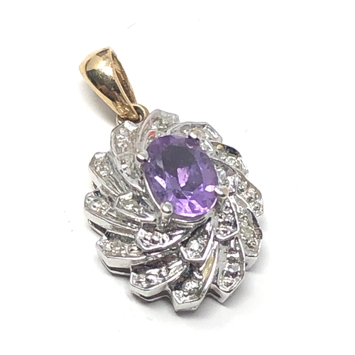 96 - 9ct white & yellow gold amethyst & diamond pendant measures approx 2.2cm drop weight 2.9g