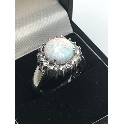 601 - 14ct white gold opal & clear gemstone halo ring (6.1g)