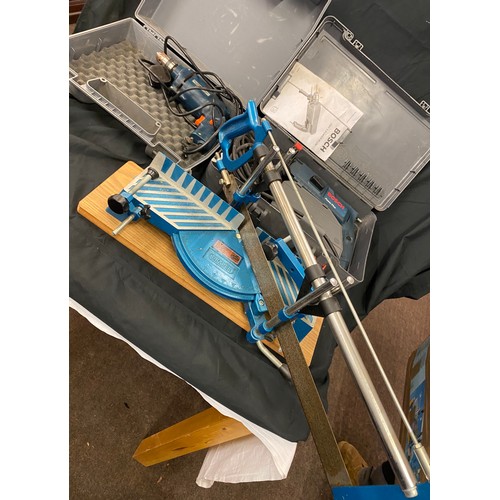 291 - 2 Bosch drills, in need of repair and a mitre saw