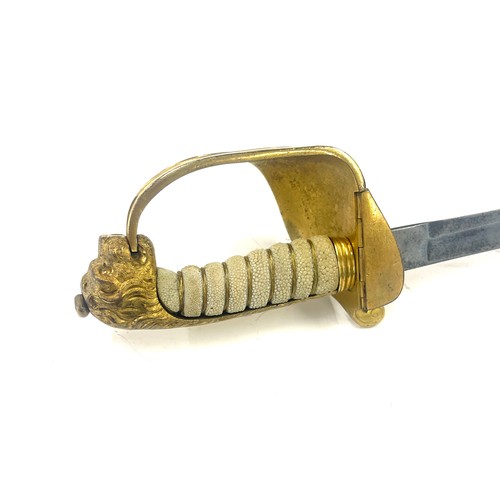 553 - British naval sword, blade length approximately 29 inches, together with a Paisleys Glasgow tunic