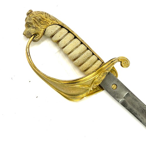 553 - British naval sword, blade length approximately 29 inches, together with a Paisleys Glasgow tunic