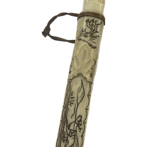 532 - Tribal art Sami knife, bone handle and scabbard, decorated with reindeer and sledge, hilt is the sha... 