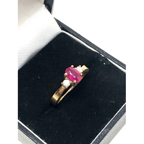 168 - 9ct gold ruby & diamond three stone dress ring (2g)