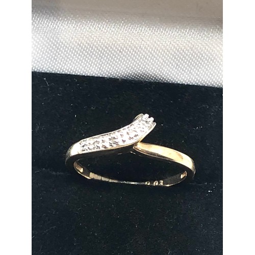 266 - 9ct gold diamond crossover ring (1.9g)