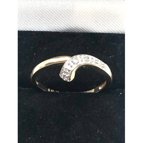 266 - 9ct gold diamond crossover ring (1.9g)