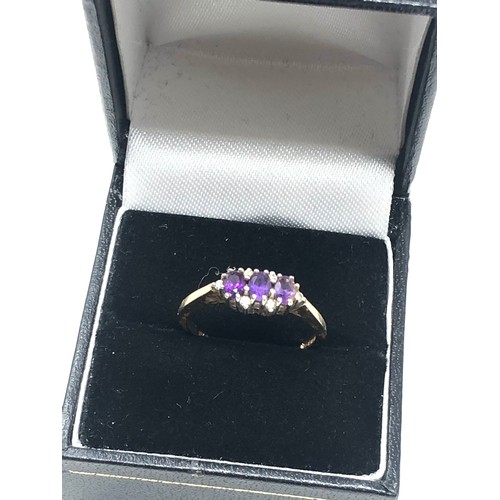 269 - 9ct gold diamond & amethyst trilogy ring (2.3g)