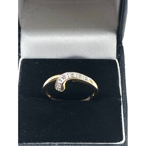 274 - 9ct gold diamond wrap ring (1.8g)