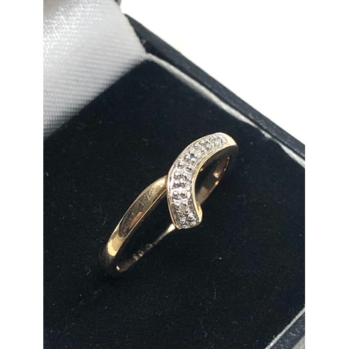 274 - 9ct gold diamond wrap ring (1.8g)