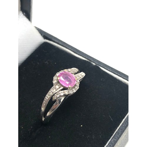 151 - 9ct white gold pink sapphire & diamond twist setting ring (2.1g)