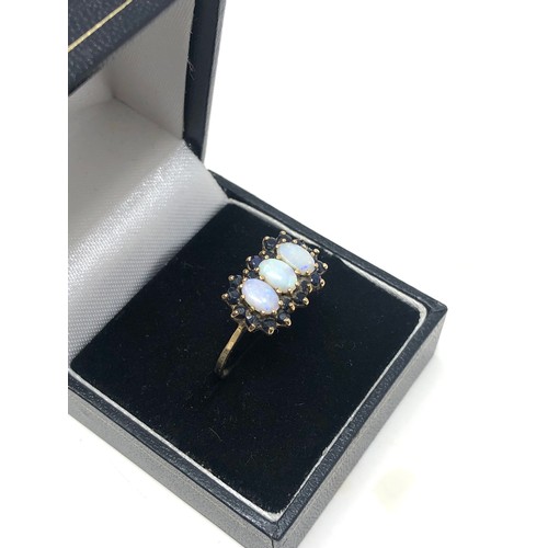 175 - 9ct gold opal & sapphire three stone halo dress ring (2.2g)