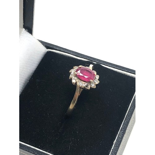 180 - 9ct gold ruby & diamond floral halo ring (2.2g)