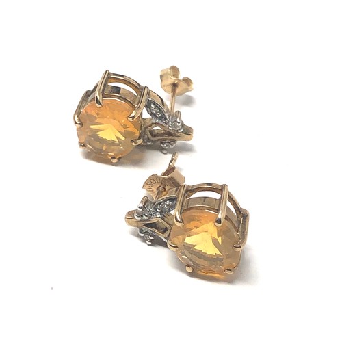 131 - 9ct gold vintage yellow gemstone & diamond floral earrings (3.7g)