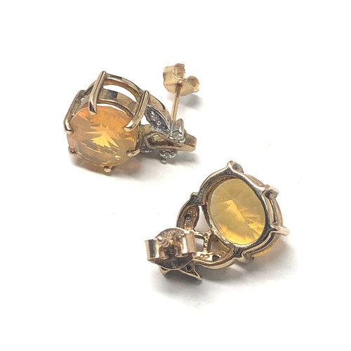 131 - 9ct gold vintage yellow gemstone & diamond floral earrings (3.7g)