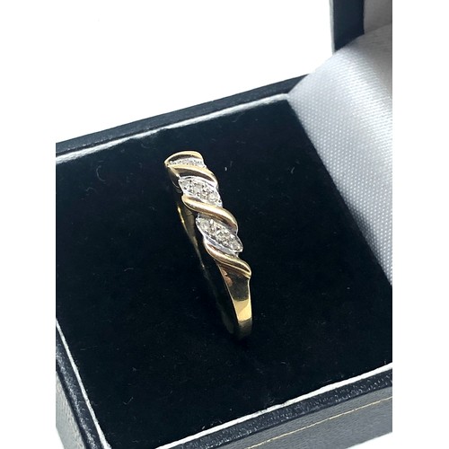 134 - 9ct gold diamond twist setting ring (2.1g)