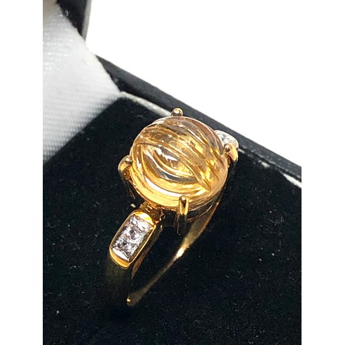 196 - 9ct gold carved citrine fronted ring (3.9g)