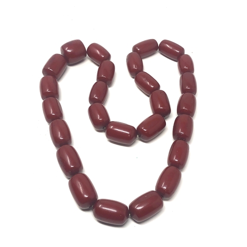 105 - Fine cherry amber bakelite barrel bead necklace large even sized beads with good internal streaking ... 