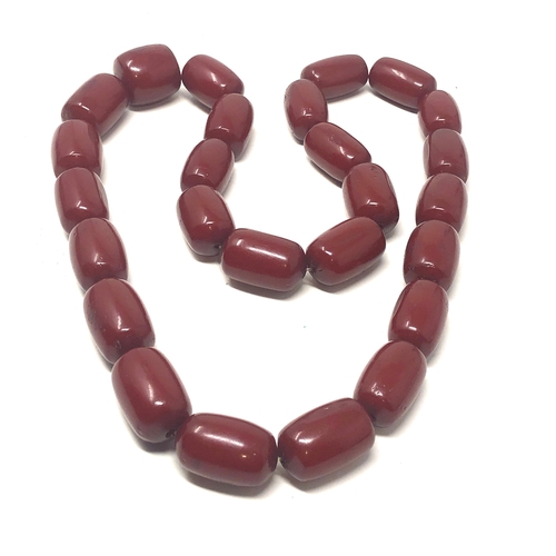 105 - Fine cherry amber bakelite barrel bead necklace large even sized beads with good internal streaking ... 