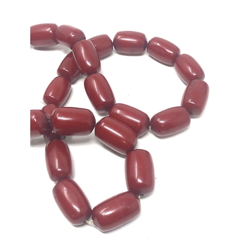 105 - Fine cherry amber bakelite barrel bead necklace large even sized beads with good internal streaking ... 