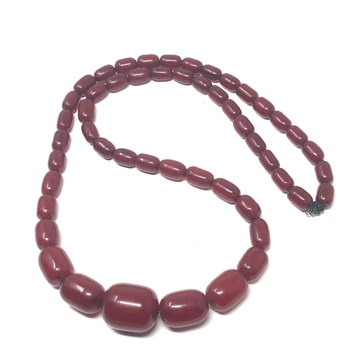 106 - Fine cherry amber bakelite barrel bead necklace large graduated  beads with good internal streaking ... 