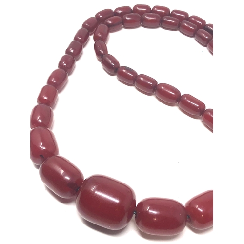 106 - Fine cherry amber bakelite barrel bead necklace large graduated  beads with good internal streaking ... 