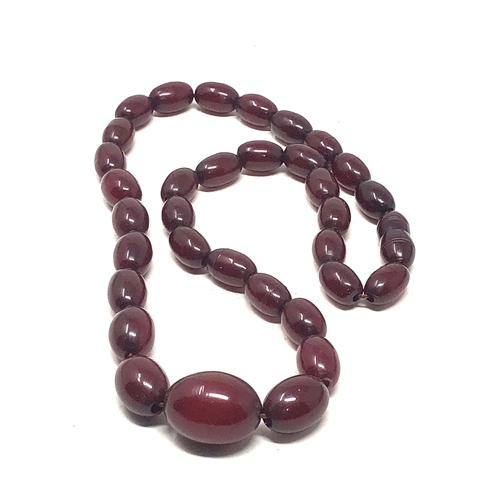 79 - Cherry amber bakelite necklace good internal streaking weight 22.5g