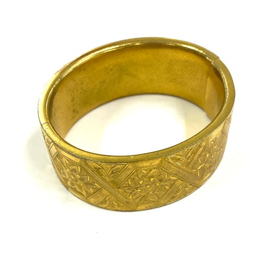 569 - Victorian gilt metal bangle in original fitted case