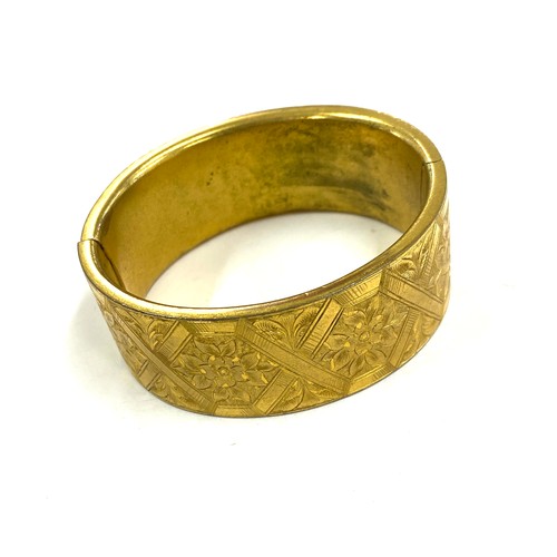 569 - Victorian gilt metal bangle in original fitted case